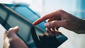 finger-tipping-at-tablet